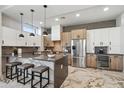 Modern kitchen with a large island, stainless steel appliances, and sleek countertops at 377 E Windsor Ave # 2, Phoenix, AZ 85004