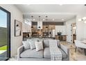 Comfortable living room featuring a modern kitchen, gray sofa, and stylish accents at 377 E Windsor Ave # 2, Phoenix, AZ 85004