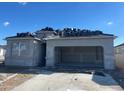 New construction home featuring a spacious two car garage and tile roof installation at 469 W Freedom St, Florence, AZ 85132