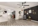 Inviting living room featuring sleek floors, modern decor, and a stylish bar cart at 7006 N 14Th Ave, Phoenix, AZ 85021