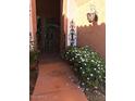 Welcoming front entrance with decorative gate, lantern and landscaping at , Gilbert, AZ 85234