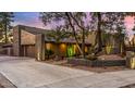 Beautiful home featuring desert landscaping, modern xeriscaping, and a two-car garage at 122 E Loma Vista Dr, Tempe, AZ 85282