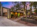 Beautiful home featuring desert landscaping, modern xeriscaping, and a two-car garage at 122 E Loma Vista Dr, Tempe, AZ 85282