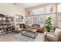 Bright living room with large windows, stylish furnishings, and a contemporary aesthetic at 16428 N 59Th St, Scottsdale, AZ 85254