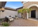 Relaxing outdoor courtyard with stylish seating and lush palm trees at 253 W Malibu Dr, Chandler, AZ 85248