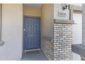 Close-up of the front door with a visible house number and brick-accented columns at 38179 W La Paz St, Maricopa, AZ 85138