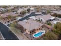 An aerial view of this beautiful property and backyard featuring a private pool, putting green, and desert landscaping at 4109 N Twilight Cir, Mesa, AZ 85207