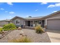 Well-maintained single-story home featuring a low maintenance yard with desert landscaping at 5061 E Edgewood Ave, Mesa, AZ 85206