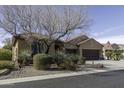 Charming single-story home featuring a three-car garage, desert landscaping and flag at 5450 N Globe Dr, Eloy, AZ 85131