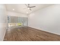 Bedroom with sliding glass door and ceiling fan at 6125 E Indian School Rd # 228, Scottsdale, AZ 85251