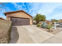 Desert-landscaped front yard and extended driveway enhance the exterior of this single-Gathering home at 7946 W Sonoma Way, Florence, AZ 85132