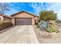 Inviting single-story home featuring xeriscaping and a spacious driveway for easy parking at 7946 W Sonoma Way, Florence, AZ 85132