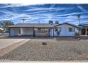 Charming single-story home with modern xeriscaping and a covered carport at 901 W Parkway Blvd, Tempe, AZ 85281