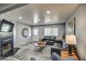 Comfortable living room featuring modern gray walls and a decorative black tiled fireplace at 901 W Parkway Blvd, Tempe, AZ 85281