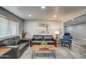 Open concept living area with stylish furniture and bright recessed lighting throughout at 901 W Parkway Blvd, Tempe, AZ 85281