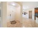 Bright foyer with decorative tile and neutral walls leading to the dining and kitchen areas at 10829 N 11Th Pl, Phoenix, AZ 85020