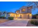 Spacious home exterior featuring a wide driveway and meticulously landscaped front yard at 1737 E Azalea Dr, Gilbert, AZ 85298
