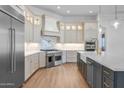 Bright kitchen showcases stainless steel appliances, quartz countertops, and custom cabinets at 21442 E Excelsior Ave, Queen Creek, AZ 85142