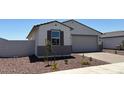 Attractive one-story home featuring a two-car garage and meticulously maintained landscaping at 24369 W La Salle St, Buckeye, AZ 85326