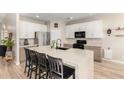 Stylish kitchen showcases a large island with seating, stainless steel appliances, and sleek countertops at 3765 E Del Rio St, Gilbert, AZ 85295