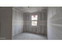 Bedroom under construction features drywall, standard window, with visible electrical wiring ready to be completed at 37713 N Cowboy Ln, San Tan Valley, AZ 85140