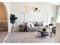 Cozy living room with stylish decor, neutral tones, and comfortable seating at 4026 W Saint John Rd, Glendale, AZ 85308