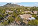 Desert home with a private pool and patio nestled in a lush, gated community with mountain views at 6128 E Brilliant Sky Dr, Scottsdale, AZ 85266
