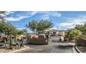 Beautiful two-story home with a tile roof, gated entry, and desert landscaping at 6230 S Mesa Vista Dr, Gold Canyon, AZ 85118