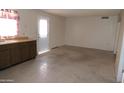 Bright living room with linoleum flooring and direct access to back door at 6351 W Mountain View Rd, Glendale, AZ 85302