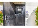 Close-up of the condo's secure front door and cheerful welcome sign at 7720 E Heatherbrae Ave # 13, Scottsdale, AZ 85251