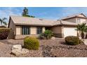 Inviting single-story home featuring desert landscaping and a front-facing two-car garage at 904 W Horseshoe Ave, Gilbert, AZ 85233