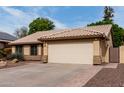 Exterior shot showcases a two-car garage and desert landscaping at 904 W Horseshoe Ave, Gilbert, AZ 85233