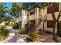 Attractive condo building with well-maintained landscaping and stairs leading to upper units at 9990 N Scottsdale Rd # 2049, Paradise Valley, AZ 85253