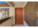 Stylish front door with a screen door and a light-colored exterior wall at 9990 N Scottsdale Rd # 2049, Paradise Valley, AZ 85253