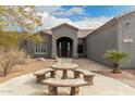 Close-up showcasing the front entrance with a decorative table and seating area at 10203 N Burris Rd, Casa Grande, AZ 85122