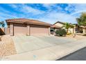 Lovely single-story home with a three car garage and low-maintenance landscaping at 11056 E Nopal Ave, Mesa, AZ 85209