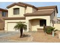 Charming two-story home features a two-car garage, low maintenance yard, and neutral color palette at 14334 W Avalon Dr, Goodyear, AZ 85395