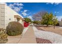 Beautifully landscaped community space featuring trees, seating, and walking paths at 17247 N 106Th Ave, Sun City, AZ 85373