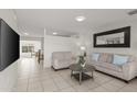 Inviting living room featuring neutral tones, tiled floors, and comfortable seating at 18 N 132Nd St, Chandler, AZ 85225