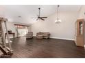 Spacious living room featuring dark wood floors, high ceilings, and a cozy seating arrangement at 21 W Ranch Rd, Tempe, AZ 85284