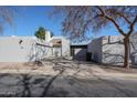 Contemporary-style home with a private courtyard and stucco walls showcasing clean architectural lines at 2113 N Squire Ave, Tempe, AZ 85288