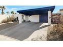 Well-maintained carport with ample parking space, complemented by drought-tolerant landscaping at 3133 W Christy Dr, Phoenix, AZ 85029