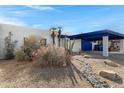 Desert landscaping enhances this home's curb appeal, with a covered carport providing shade and parking at 3133 W Christy Dr, Phoenix, AZ 85029