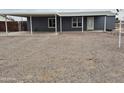 Single-story home with covered parking and gravel driveway at 329 N 83Rd Pl, Mesa, AZ 85207