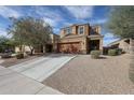 Charming two-story home with desert landscaping and a spacious two car garage at 3482 N 300Th Dr, Buckeye, AZ 85396