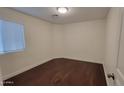 A simple bedroom featuring hardwood floors and a window with coverings at 4517 N 123Rd Dr, Avondale, AZ 85392