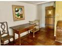 Entryway with tiled floors, white walls, vintage furniture, and decorative door at 537 N Jay St, Chandler, AZ 85225