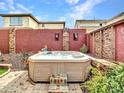 Relaxing hot tub surrounded by lush greenery and decorative stone accents at 6847 W Palo Brea Ln, Peoria, AZ 85383