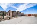 Beautiful desert home with a grand driveway and three-car garage at 8612 S 30 Th Way, Phoenix, AZ 85042