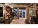 Brick-walled office with wood floors, floating shelves, and large windows providing natural light at 8612 S 30 Th Way, Phoenix, AZ 85042